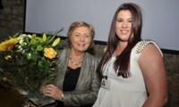 Ms. Frances Fitzgerald, Minister for Children receives a bouquet of flowers from Exchange House staff member Donna O'Donnell